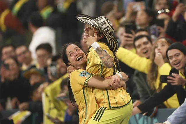 Colombia's Diana Ospina Garcia, left, and Colombia's Carolina Arias celebrate at the end of the Women's World Cup round of 16 soccer match between Jamaica and Colombia in Melbourne, Australia, Tuesday, August 8, 2023. (Photo by Hamish Blair/AP Photo)