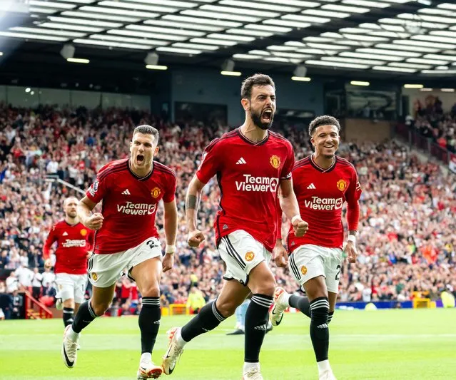 Bruno Fernandes of Manchester United celebrates scoring their third goal during the Premier League match between Manchester United and Nottingham Forest at Old Trafford on August 26, 2023 in Manchester, England. (Photo by Ash Donelon/Manchester United via Getty Images)