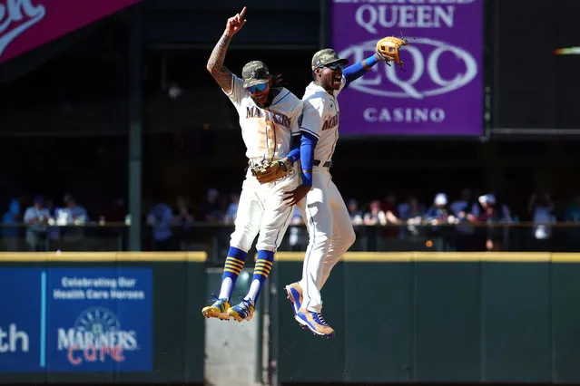 J.P. Crawford #3 (L) and Kyle Lewis #1 of the Seattle Mariners celebrate the 3-2 win against the Cleveland Indians at T-Mobile Park on May 16, 2021 in Seattle, Washington. (Photo by Abbie Parr/Getty Images)