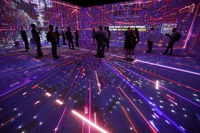 People watch a lights performance at TelcoDR Cloud City during the Mobile World Congress (MWC) in Barcelona, Spain, June 29, 2021. (Photo by Albert Gea/Reuters)