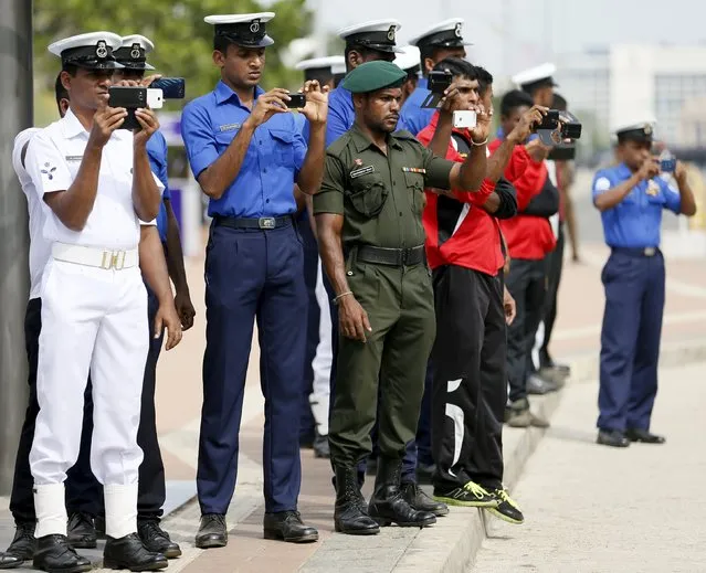 Members from Sri Lankan military use their mobile phones to take pictures at the parade during a rehearsal for Sri Lanka's 68th Independence day celebrations in Colombo, February 2, 2016. (Photo by Dinuka Liyanawatte/Reuters)