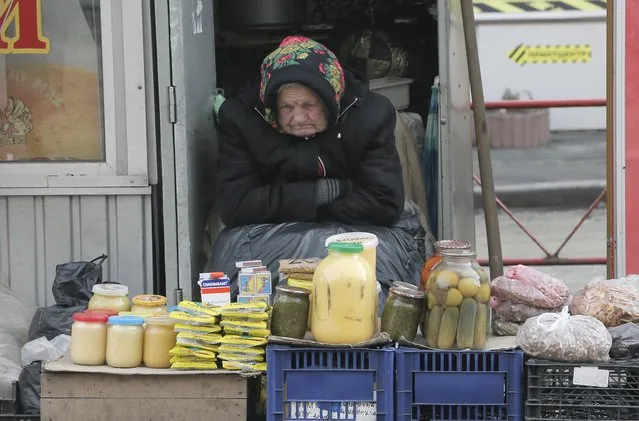 An elderly Ukrainian woman sells home made product  in downtown Kiev, Ukraine, on Wednesday, February 3, 2016. A  World Bank report  predicts the Ukrainian economy will grow by 1 percent in 2016, this is after a 12 percent reduction in 2015. It also forecasts an economic growth of 2 percent for 2017. According to the Global and Economic Prospects report: “Growth in Ukraine may start rebounding, helped by easing tensions and the IMF supported stabilization program”. (Photo by Efrem Lukatsky/AP Photo)