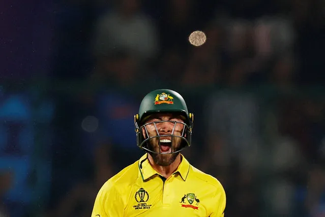Australia's Glenn Maxwell celebrates after scoring a century (100 runs) during the 2023 ICC Men's Cricket World Cup one-day international match between Australia and Netherlands at the Arun Jaitley Stadium in New Delhi on October 25, 2023. (Photo by Adnan Abidi/Reuters)
