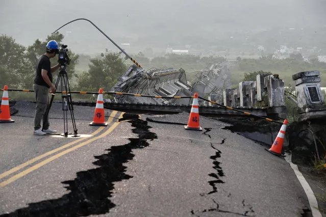 A journalist films the damaged Gaoliao bridge that collapsed after a magnitude 6.8 earthquake hit Yuli Township; in Hualien County, Taiwan, 19 September 2022. The series of earthquakes and aftershocks on 18 September, caused minor structural damage and derailed a train in eastern Taiwan. (Photo by Ritchie B. Tongo/EPA/EFE)