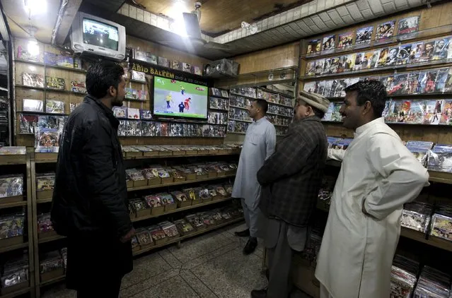 Men watch the Pakistan Super League (PSL) cricket match between Islamabad United and Peshawar Zalmi on TV sets at a CD shop in Rawalpindi, Pakistan, February 21, 2016. Pakistan's inaugural national cricket league has been an unexpected success, even though all the matches have been played in the United Arab Emirates due to security risks. (Photo by Faisal Mahmood/Reuters)