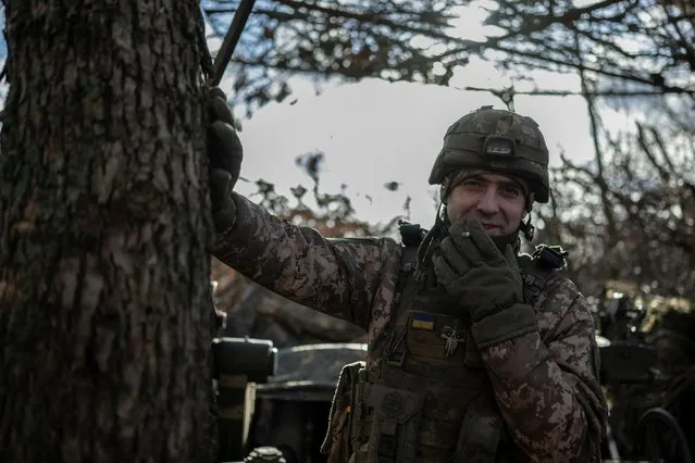 A Ukrainian serviceman of the 55th Separate Artillery Brigade smokes at a position near the front line town of Marinka, amid Russia's attack on Ukraine, in Donetsk region, Ukraine on December 26, 2023. (Photo by Viacheslav Ratynskyi/Reuters)