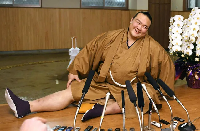New Year Grand Sumo Tournament winner ozeki Kisenosato Yutaka stretches his legs during a press conference at his Tagonoura stable in Tokyo, a day after ending the tournament with a 14-1 record, in this photo taken by Kyodo on January 23, 2017. (Photo by Reuters//Kyodo News)