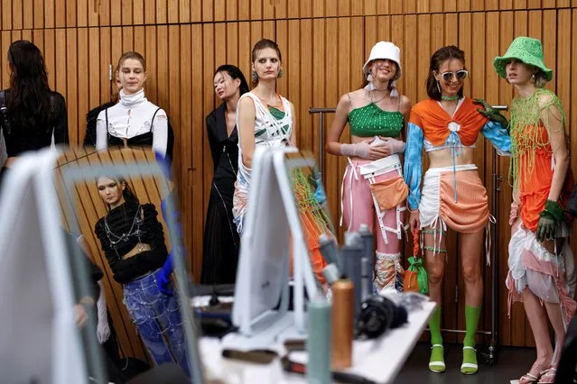 Models wait at the backstage before the “Fashion X AI : Call For Young Talents 2022” fashion show in Hong Kong, China on December 19, 2022. (Photo by Tyrone Siu/Reuters)