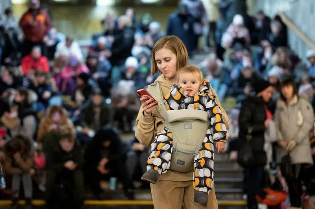 People take shelter inside a metro station during massive Russian missile attacks in Kyiv, Ukraine on December 29, 2022. (Photo by Viacheslav Ratynskyi/Reuters)