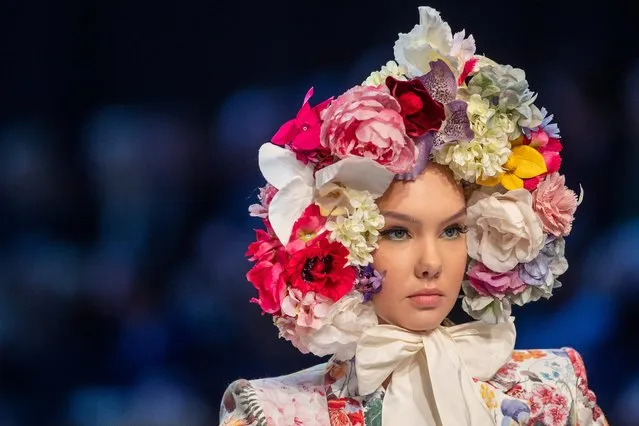 A model presents a creation from the Lithuanian designer Juozas Statkevicius' Haute Couture Spring-Summer 2022 fashion collection in Vilnius, Lithuania, Wednesday, November 17, 2021. (Photo by Mindaugas Kulbis/AP Photo)