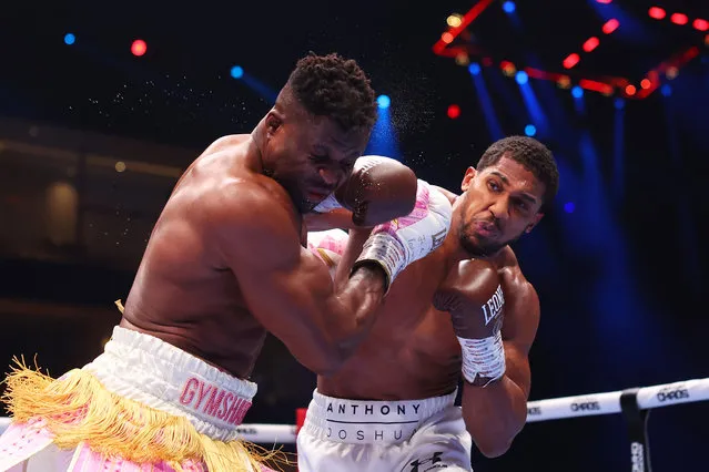 Anthony Joshua punches Francis Ngannou during the Heavyweight fight between Anthony Joshua and Francis Ngannou on the Knockout Chaos boxing card at the Kingdom Arena on March 08, 2024 in Riyadh, Saudi Arabia. (Photo by Richard Pelham/Getty Images)