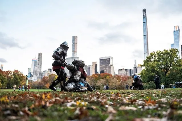 Members of Gladiators NYC league dressed in medieval armor fight each other in Central Park with a view of the skyline in the background on November 13, 2021 in New York City. (Photo by Alexi Rosenfeld/Getty Images)