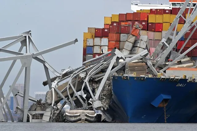 Shown is a partially collapsed Francis Scott Key Bridge following an early morning accident involving a container ship striking a support column on March 26, 2024 in Baltimore, Md. (Photo by Ricky Carioti/The Washington Post)