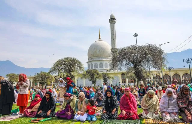 Muslim faithfuls attend Eid-al Fitr prayer at Hazratbal shrine in Srinagar, the summer capital of Indian Kashmir, 10 April 2024. Authorities have been disallowing congregational prayers at the main Jamia Masjid Mosque on many Fridays and Eid al-Fitr to avert any law and order situation. However, in other parts of Kashmir, prayers were offered in mosques and shrines. The biggest Eid congregation was held at Hazratbal shrine in Srinagar. Muslims worldwide celebrate Eid al-Fitr, a two or three-day festival, at the end of the Muslim holy fasting month of Ramadan. It is one of the two major holidays in Islam. During Eid al-Fitr, most people travel to visit each other in town or outside of it and children receive new clothes and money to spend for the occasion. (Photo by Farooq Khan/EPA/EFE/Rex Features/Shutterstock)