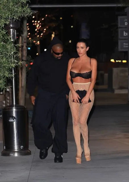 American rapper Kanye West and his wife Bianca Censori turn heads after enjoying dinner at Gigi's in Los Angeles on April 4, 2024. Bianca, who is known for eye-catching outfits, was sporting a black bra as a top during the night out. (Photo by Backgrid USA)
