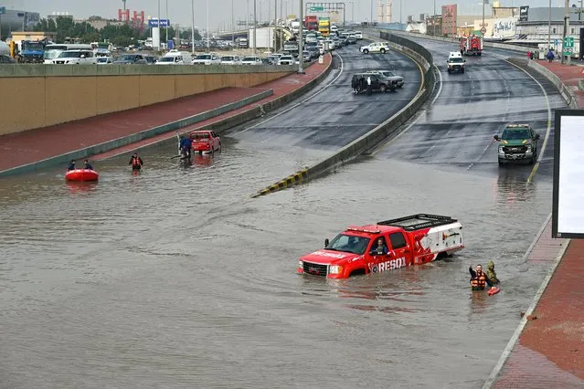 Vehicles stuck in flood water following heavy rain in Kuwait City, Kuwait on January 2, 2022. Heavy rain caused disruption to traffic in Kuwait City at the weekend. It also forced many schools and businesses to close. (Photo by Noufal Ibrahim/EPA/EFE/Rex Features/Shutterstock)
