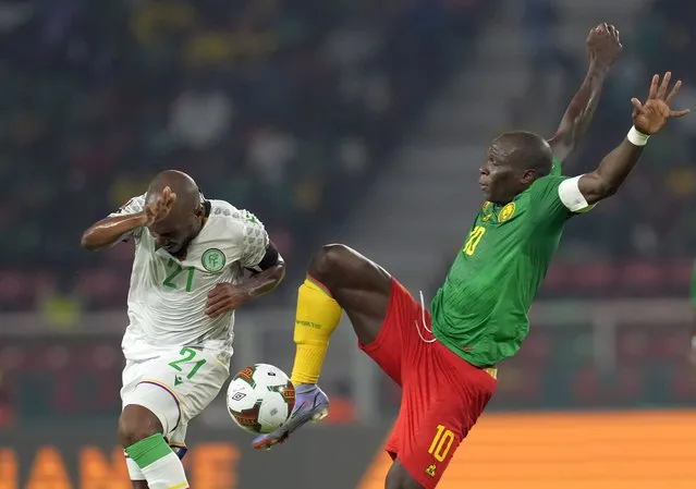 Comoros' El Fardou Ben Nabouhane, left, defends as Cameroon's Vincent Aboubakar controls the ball, during the African Cup of Nations 2022 round of 16 soccer match between Cameroon and Comoros at the Olembe stadium in Yaounde, Cameroon, Monday, January 24, 2022. (Photo by Themba Hadebe/AP Photo)