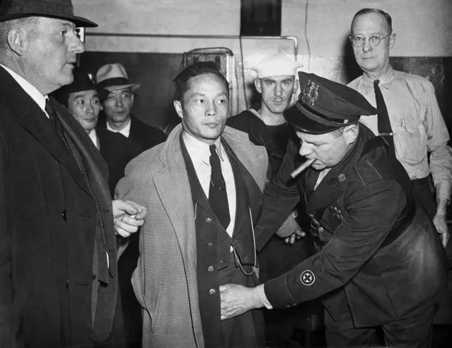 This December 7, 1941 file photo shows a Japanese man under arrest in the roundup at Norfolk, Va., being searched by a policeman after Japan's declaration of war on the U.S. Beliefs that Hispanics and Asians living in the U.S. won't assimilate or refuse to speak English are based on stereotypes that scholars say are linked to notions of white supremacy. Throughout American history, Hispanics and Asians have been pressured to adopt the customs of the mainstream white population. The pressure came even as some laws forbade them from voting, intermarrying and having access to education and public facilities. (Photo by AP Photo/File)