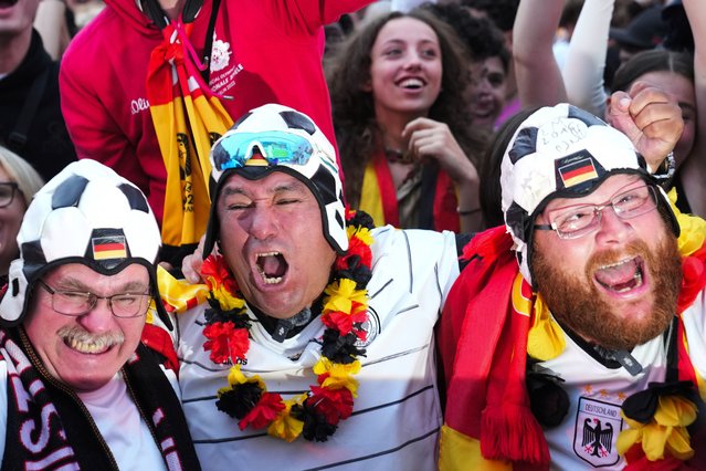 Fans cheer as they watch a Group A match between Germany and Scotland at the Euro 2024 soccer tournament in Berlin, Germany, Friday, June 14, 2024. (Photo by Ebrahim Noroozi/AP Photo)