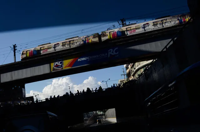 A train passes by a boulevard on May 8, 2016 in Manila, Philippines. Around 11,000 public elementary schools will be used as polling places in the Philippines on May 9 voting day as the Philippines elects a new president for a six-year term. Opinion polls have shown Mr Duterte, a tough-talking mayor of Davao in Mindanao, maintaining a clear lead in the Philippines as Senator Grace Poe looks at impossible odds. The Philippine presidential campaign ended on May 7 with elections slated for May 9 and features 5 presidential candidates vying for the top post. (Photo by Dondi Tawatao/Getty Images)