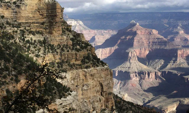 This October 22, 2012, file photo shows a view from the South Rim of the Grand Canyon National Park in Ariz.  Authorities say another visitor has died after falling from the edge of the Grand Canyon. Park rangers found the body of a 70-year-old woman about 200 feet (61 meters) below the canyon's South Rim on Tuesday, April 23, 2019. (Photo by Rick Bowmer/AP Photo/File)