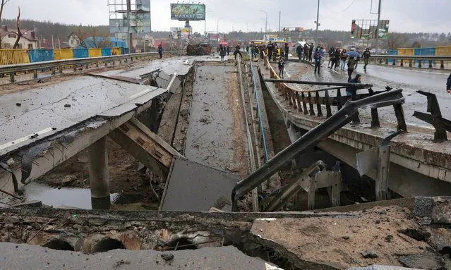 A view of the destroyed bridge across the Irpen river on the Warsaw highway, Kyiv Region, north-central Ukraine on April 8, 2022. (Photo by Ukrinform/Rex Features/Shutterstock)