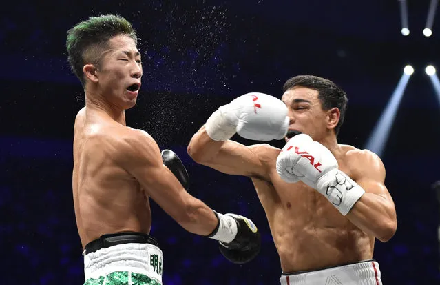 France's Nordine Oubaali (R) fights with of Japan's Takuma Inoue during their WBC bantamweight title boxing match at Saitama Super Arena in Saitama on November 7, 2019. (Photo by Kazuhiro Nogi/AFP Photo)