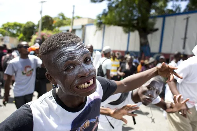 Supporters of the PHTK presidential candidate Jovenel Moise strike zombie poses during a protest march demanding the resignation of interim President Jocelerme Privert in Port-au-Prince, Haiti, Tuesday, June 7, 2016. The electoral council of Haiti has decided to re-do a presidential election that a special commission determined was marred by fraud. (Photo by Dieu Nalio Chery/AP Photo)