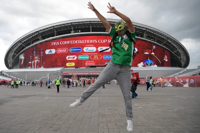 A Mexico supporter jumps outside the Kazan Arena ahead of the 2017 Confederations Cup group A football match between Portugal and Mexico in Kazan on June 18, 2017. (Photo by Franck Fife/AFP Photo)