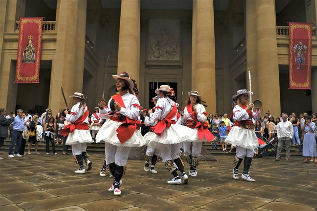 A group of dancers take part during the Corpus Christi procession, in Pamplona, northern Spain, Sunday, June 11, 2023. The day of Corpus Christi, an ancient Catholic tradition which takes place on June 8, has ceased to be a public holiday in Spain. (Photo by Alvaro Barrientos/AP Photo)