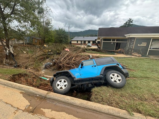 A vehicle rests in a ditch in Swannanoaon September 29, 2024. (Photo by Brady Dennis/The Washington Post)