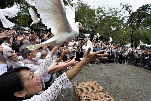 Doves are released in prayer of peace by worshippers at the Yasukuni Shrine in Tokyo, Japan, Tuesday, August 15, 2023. Japan held the annual memorial service for the war dead as the country marks the 78th anniversary of its defeat in the World War II. (Photo by Eugene Hoshiko/AP Photo)