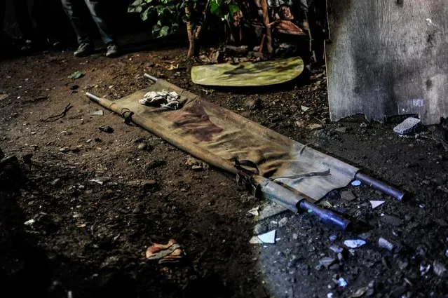 A blood-soaked stretcher is seen here after a buy-bust operation which killed three suspected drug dealers, June 25, 2016, in Manila, Philippines. (Photo by Dondi Tawatao/Getty Images)