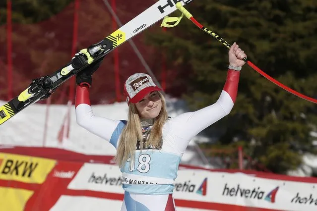 Switzerland's Lara Gut-Behrami celebrates after winning an alpine ski, women's World Cup downhill, in Crans Montana, Switzerland, Friday, February 21, 2020. (Photo by Gabriele Facciotti/AP Photo)