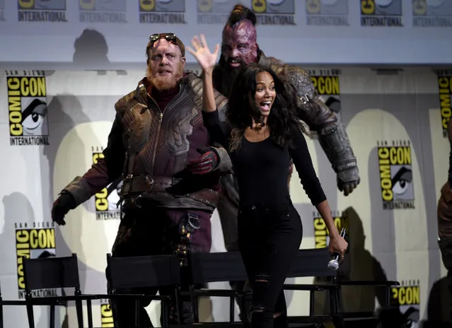 Zoe Saldana, right, walks on stage at the “Guardians of the Galaxy Vol. 2” panel on day 3 of Comic-Con International on Saturday, July 23, 2016, in San Diego. (Photo by Chris Pizzello/Invision/AP Photo)