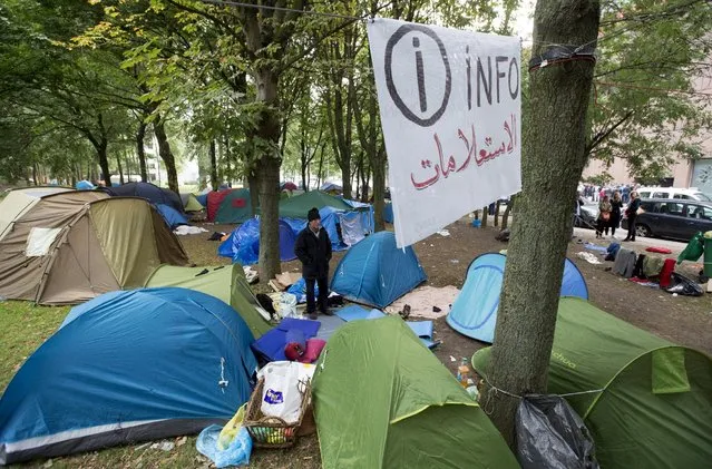 An asylum seeker waits in a makeshift camp outside the foreign office in Brussels, Belgium September 3, 2015. (Photo by Yves Herman/Reuters)