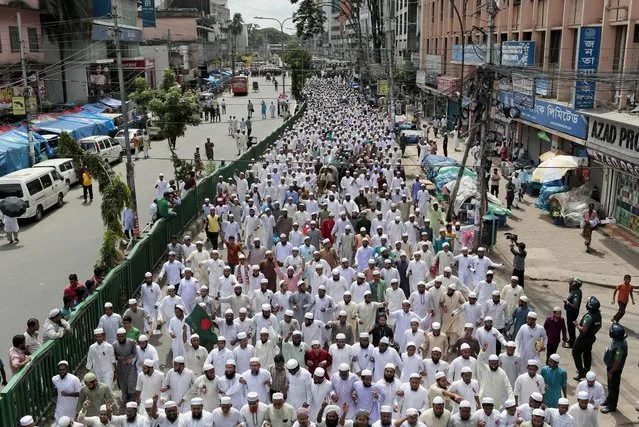 Bangladeshi Muslims participate in a rally to protest against terrorism outside the national mosque in Dhaka, Bangladesh, Friday, August 5, 2016. Hundreds of activists of Hifazat-e-Islam Bangladesh, an orthodox Islamic group, protested against terrorism and recent terror attacks in Dhaka. (Photo by AP Photo/Stringer)