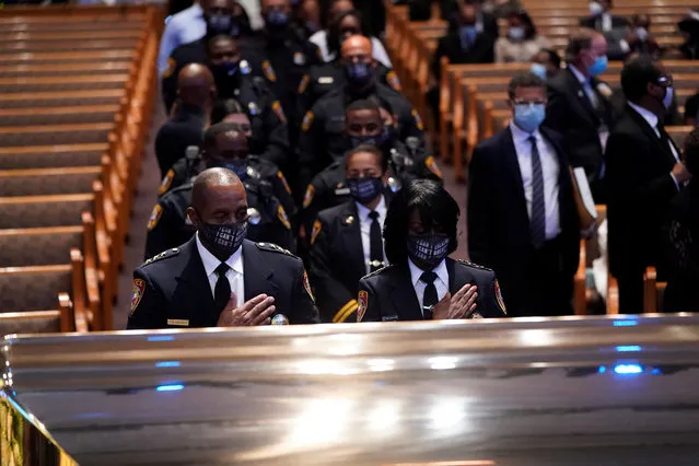 Members of the Texas South University police department pause by the casket of George Floyd during a funeral service at the Fountain of Praise church, in Houston, Texas, U.S., June 9, 2020. (Photo by David J. Phillip/Pool via Reuters)