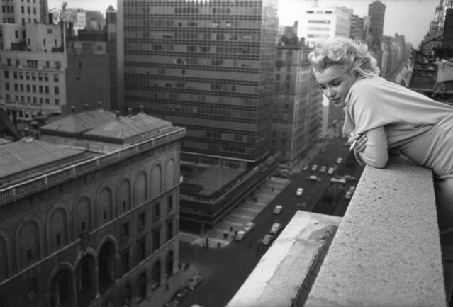 NEW YORK CITY - MARCH 1955: American actress Marilyn Monroe (1926 - 1962) leans over the balcony of the Ambassador Hotel in March 1955 in New York City, New York. (Photo by Michael Ochs Archives)