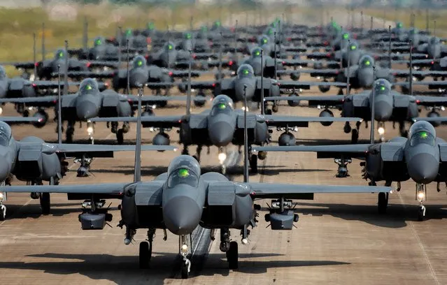 South Korean Air Force F-15K fighter jets taxi into a position during an “elephant walk” at an unidentified air base, South Korea, May 24, 2022. Picture taken May 24, 2022. (Photo by Joint Chiefs of Staff/Yonhap via Reuters)