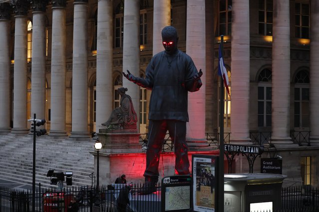 A large statue depicting US rap singer and actor Scott Ramon Seguro Mescudi, aka Kid Cudi, is installed in front of the Palais Brongniart in Paris, on January 12, 2024. (Photo by Alain Jocard/AFP Photo)
