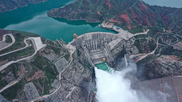 Aerial photo taken on July 9, 2020 shows water gushing out from a gate of the Lijiaxia Hydropower Station at the border of Jainca County and Hualong County in northwest China's Qinghai Province. Due to the increasing amount of water inflow volume from the upper reaches of the Yellow River, the Lijiaxia Hydropower Station started to open the gate to release water from June 18 as a way to prepare for the flood peak. (Photo by Chine Nouvelle/SIPA Press/Rex Features/Shutterstock)