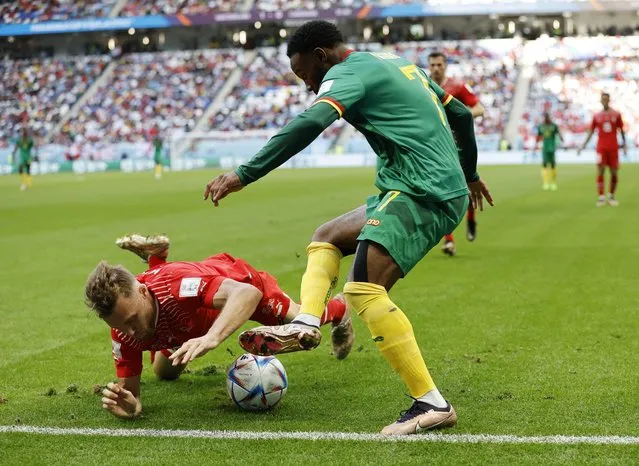 Georges-Kevin Nkoudou of Cameroon controls the ball against Silvan Widmer of Switzerland during the FIFA World Cup Qatar 2022 Group G match between Switzerland and Cameroon at Al Janoub Stadium on November 24, 2022 in Al Wakrah, Qatar. (Photo by Issei Kato/Reuters)
