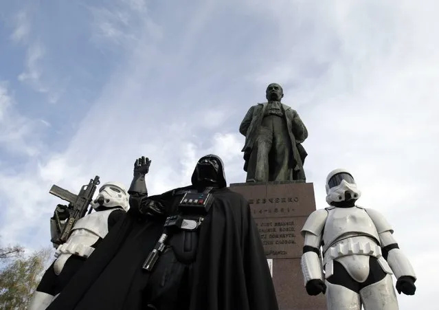 Activists from the Ukrainian Internet Party, dressed as characters from the Star Wars movies, take part in the last day of election campaigning in the center of Kiev, on October 24, 2014. Ukraine wraps up campaigning Friday for a weekend vote that will dramatically reshape parliament after a year of upheavals, as the deadly conflict with pro-Russian rebels drags on into its seventh month. (Photo by Anatolii Stepanov/AFP Photo)