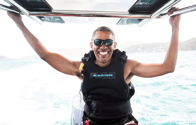 Former President Barack Obama sits on a boat during a kite surfing outing with British businessman Richard Branson during his holiday on Branson's Moskito island, in the British Virgin Islands, in a picture handed out by Virgin on February 7, 2017. (Photo by Jack Brockway/Reuters/Virgin)