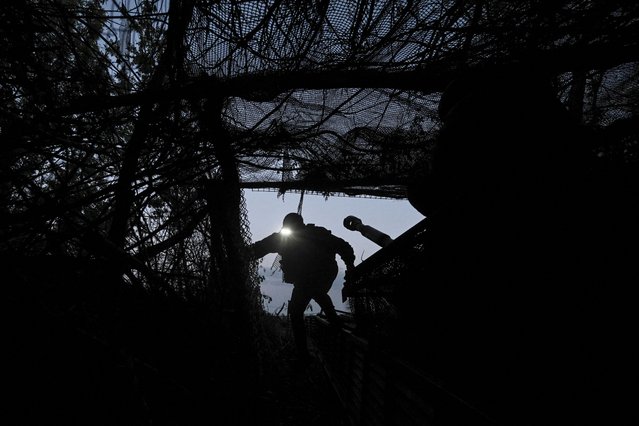 A serviceman of the 141st Separate Mechanized Brigade of the Ukrainian Armed Forces prepares 2S1 Gvozdika self-propelled howitzer for firing towards Russian troops, at a position in a front line, amid Russia's attack on Ukraine, in Donetsk region, Ukraine on May 13, 2025. (Photo by Reuters/Stringer)