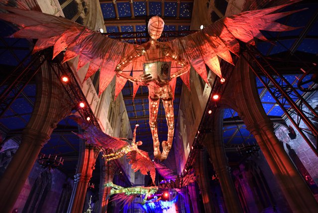 An illuminated model of the archangel Uriel hangs above the nave of St Mary’s Church in Beverley, East Yorkshire on December 10, 2022 alongside six other willow and tissue angels including Gabriel and Michael. The installation by Anne-Marie Kerr is the centrepiece of a Festival of Angels, which opened yesterday and continues until January 14. (Photo by Guzelian)