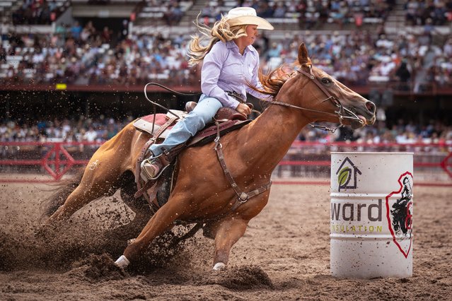 Halle Hladky from Gillette, Wyo. competes in barrell racing during the 129th anniversary Cheyenne Frontier Days Rodeo on Tuesday, July 22, 2025, in Frontier Park Arena in Cheyenne, Wyo. (Photo by Milo Gladstein/Wyoming Tribune Eagle via AP Photo)