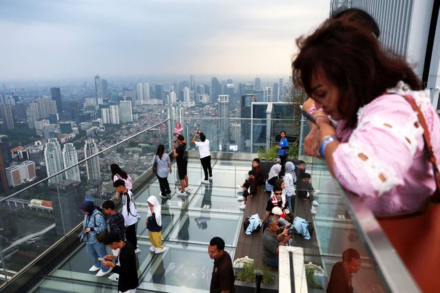 Visitors enjoy the UP sky garden view at Thamrin Nine building in Jakarta, Indonesia on June 26, 2025. (Photo by Ajeng Dinar Ulfiana/Reuters)