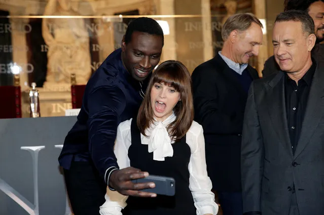 Actor Omar Sy (L) takes a picture with actress Felicity Jones (2nd to L) as actor Tom Hanks (R) looks during a screening of their film “Inferno” in Florence, Italy October 6, 2016. (Photo by Max Rossi/Reuters)